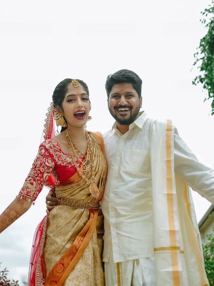 A fun, expressive shot of a newly married couple, full of joy and excitement. We love capturing your personalities in your wedding photos.