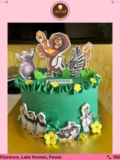 This Madagascar-themed cake brings the fun of the animated movie to life. The cake is decorated with green frosting and edible character cutouts, making it a hit at any kid's birthday party.