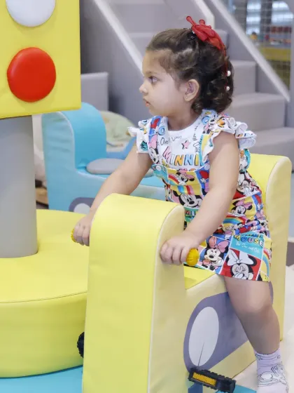Dressed in a cute cartoon outfit, this little one is ready to ride around our soft play area.