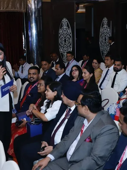 Interacting with the audience during the Axis Max Life unveiling ceremony, ensuring everyone feels included.