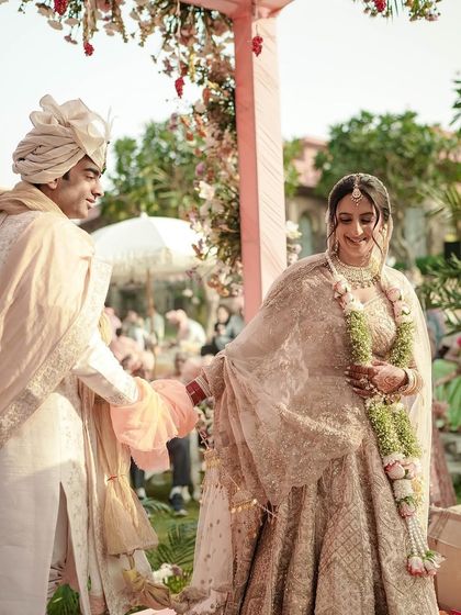 A candid moment during the wedding ceremony. The bride's hair looks flawless from every angle.