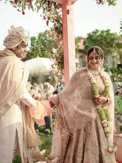 A candid moment during the wedding ceremony. The bride's hair looks flawless from every angle.