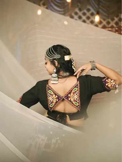 A close-up of the stunning back design of the blouse from the 'Halo re Halo' costume. The details make the outfit special.