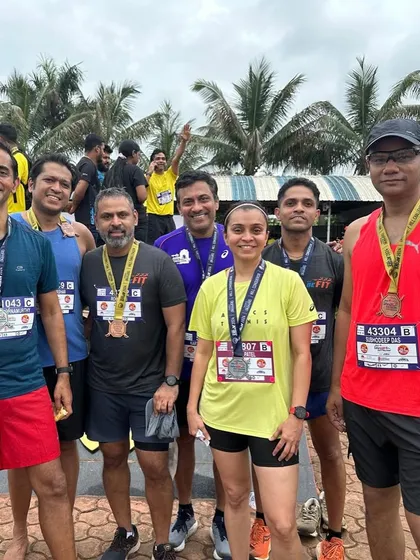 The team proudly displaying their finisher medals after the tough Satara Hill Half Marathon.