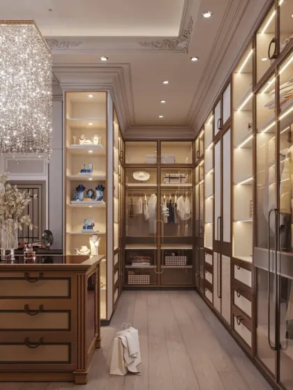 A look down the aisle of this closet, showcasing the depth of storage and the warm glow from the internal cabinet lighting. The design ensures every item is visible and easily accessible.