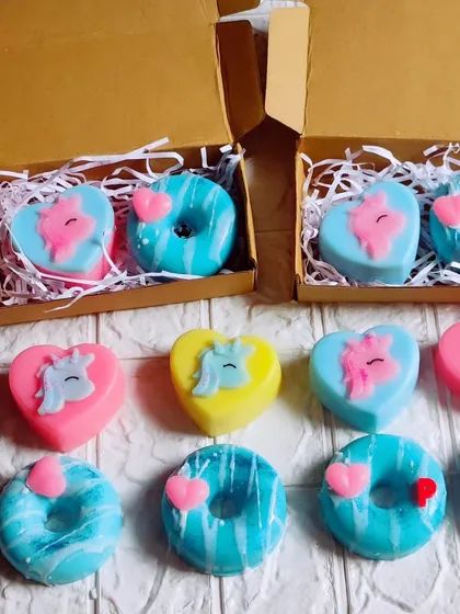 A sweet gift box set with a unicorn heart soap and a donut soap.