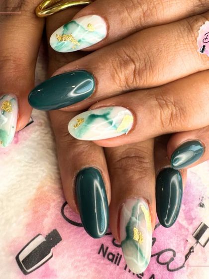 A fresh green base with a golden finish on top. This design features a mix of solid green and a green marble effect with gold foil.