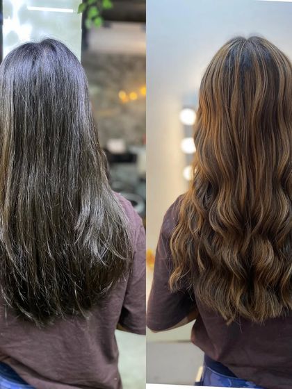 A side-by-side comparison of a hair color transformation. We took this client's hair from a flat, single tone to a dynamic, wavy style with beautiful highlights.
