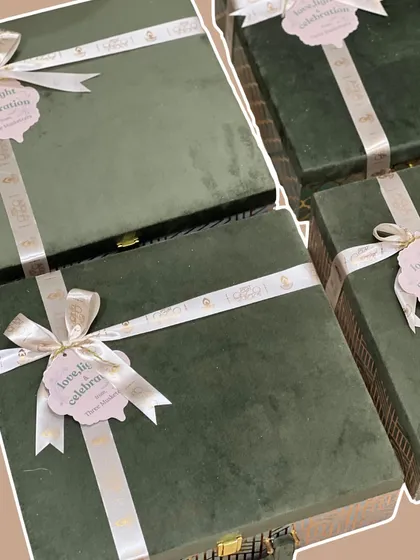 I’m obsessed with the details, and these rich, green velvet boxes are a perfect example. Finished with a custom 'Love, Light & Celebration' ribbon, they make a statement even before they are opened.