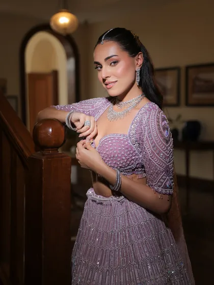 A classic portrait on a staircase. The lavender color and intricate embroidery make this a perfect choice for a modern bride or bridesmaid.