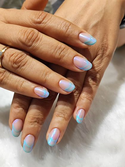 A closer look at the dreamy, electric French design. The soft blend of colors gives a unique, ethereal vibe to the classic manicure style.