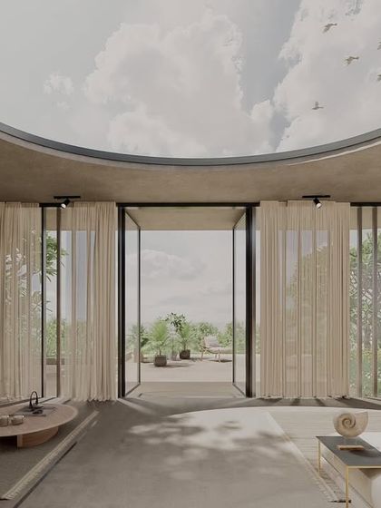 This dining area in our House of Veils project features a custom-designed table and chairs, with a focus on clean lines and a minimalist aesthetic. The space is open to the living area, creating a sense of flow and connection.