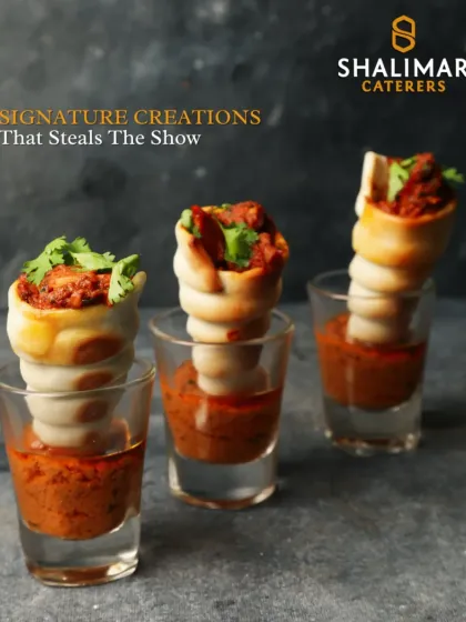 Signature creations that steal the show. These savory cones are filled with a spicy chicken mixture and served in shot glasses with a dipping sauce, a visually creative and delicious appetizer.