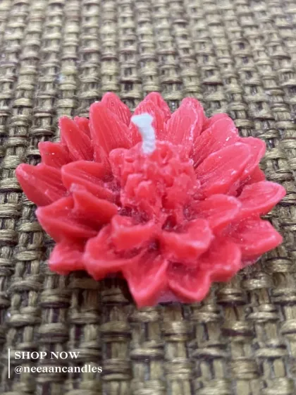 Bloom bright with every flame. This handcrafted red floral candle brings beauty, warmth, and a touch of elegance to your space.