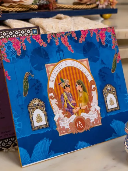 To make an invitation truly personal, I love incorporating custom elements like this charming caricature of the couple. It adds a touch of modern fun to a traditional design, telling their unique story with artistry and style.