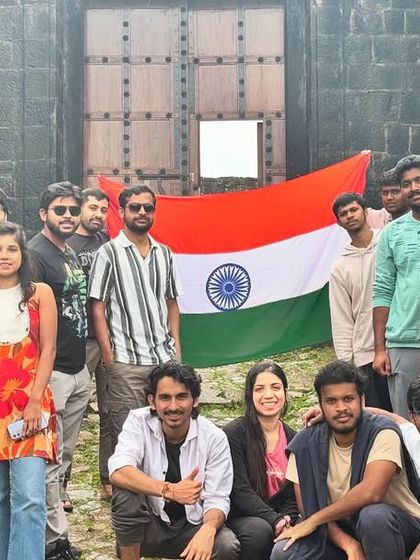 Our group proudly holding the Indian flag at the ancient gates of Kodachadri fort. A trek filled with patriotism and adventure.
