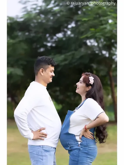Let's have some fun with it. This playful pose with matching 'bumps' brought out genuine laughter and shows the fun-loving personality of the couple. Your shoot should be about you and your vibe.
