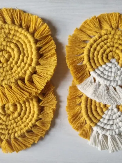 I offer my spiral coasters in different color variations, including solid yellow and a two-tone yellow and white design.