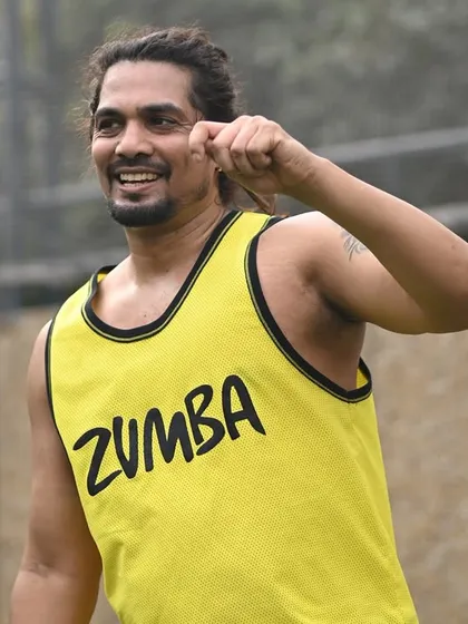 Another shot of our instructor, demonstrating the high energy that defines our fitness events. We ensure every session is a perfect blend of a great workout and a lot of fun.