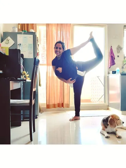 Here I am, finding a moment for a Dancer's Pose in my living room, with my two babies nearby. This is what real-life practice looks like for a mom. My online classes are designed to fit into your world, helping you find that essential 'me time' and strength amidst the beautiful chaos of motherhood.