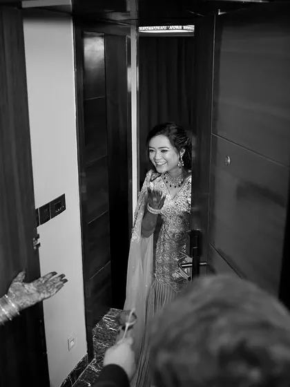 Another angle of the candid doorway moment, this black and white photo captures the pure, unscripted joy that we strive to find throughout the wedding day.