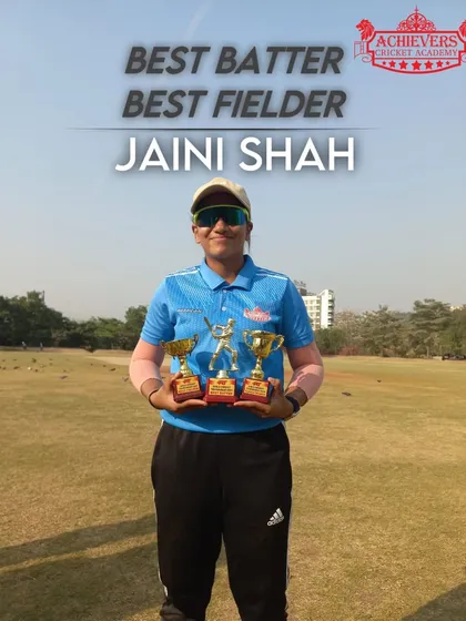 Jaini Shah with her 'Best Batter' and 'Best Fielder' trophies, showcasing her all-round excellence.
