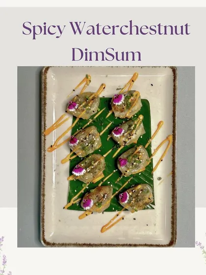 Our Spicy Waterchestnut Dim Sum, drizzled with a savory sauce and garnished with edible flowers. This dish offers a delightful crunch and a kick of spice.
