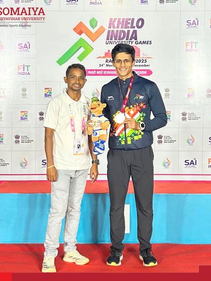 Jai Bhoir on the podium after securing third place in the 100m sprint at the Khelo India University Games 2025.