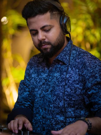 Cool, calm, and collected behind the decks. A candid moment from a weekend night at Perissa Aravali.