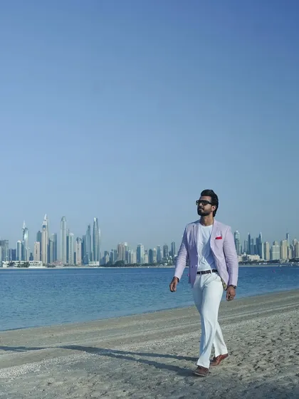 Walking along the beach in Dubai, ready for the next event. The world is my stage.