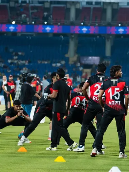 Leading the team through a dynamic warm-up under the stadium lights. This is where we set the tone for the match ahead.