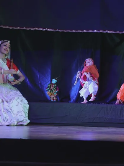 Another scene from 'Giridhar Naagar Ki Meera', where a dancer interacts with multiple puppets on stage. This dynamic interplay is a unique feature of our storytelling style.
