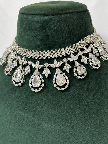 A close-up of an American diamond choker with large teardrop pendants. This rental piece is perfect for making a statement.