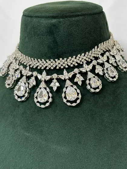 A close-up of an American diamond choker with large teardrop pendants. This rental piece is perfect for making a statement.