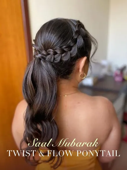 Celebrate the new year with this twist and flow ponytail. A beautiful side braid flows into a voluminous ponytail, creating a style that is perfect for Saal Mubarak celebrations.