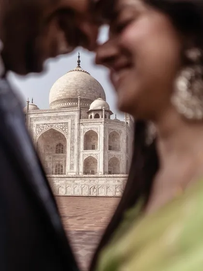 A creative perspective of a love as monumental as the Taj Mahal itself. For destination photoshoots, I look for unique angles that tell your story while honoring the iconic location.