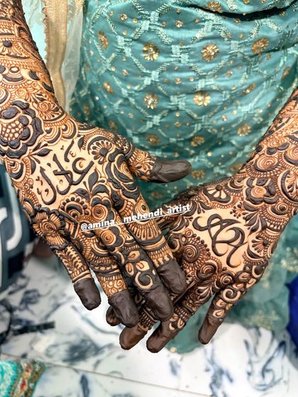 A beautiful design featuring the initials 'S' and 'R' and the name 'Saqlain' in Arabic.