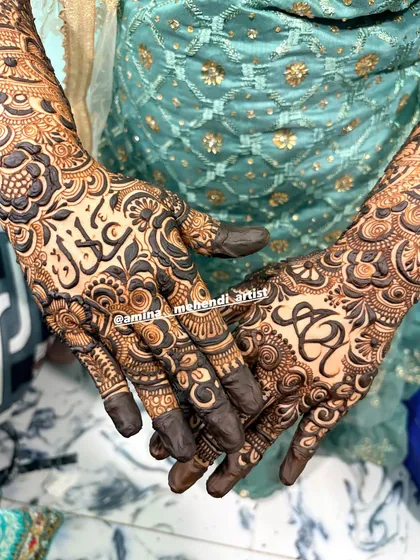 A beautiful design featuring the initials 'S' and 'R' and the name 'Saqlain' in Arabic.