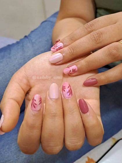 A mix of pink shades with unicorn chrome leaf patterns.