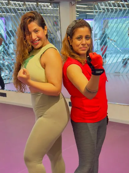 Ready to take on any challenge. Posing with a client, showcasing the strength and confidence we build together.