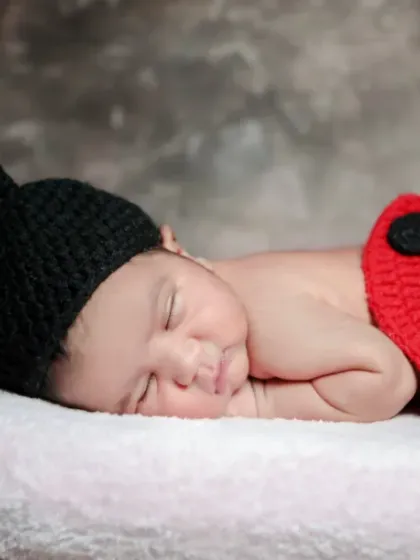 Our adorable little ladybug, sleeping so soundly. We have a collection of cute and creative props for newborn shoots.