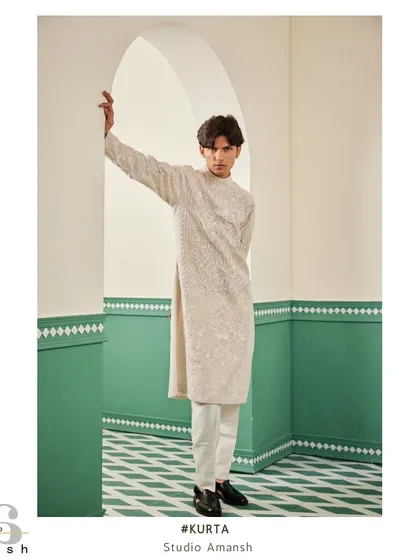 The full-length beige embroidered kurta, a timeless and elegant piece for any special occasion.