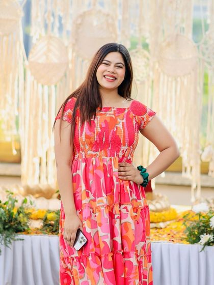 Who says you only have to wear yellow on Haldi? I love experimenting with colours like this bright pink dress to stand out.