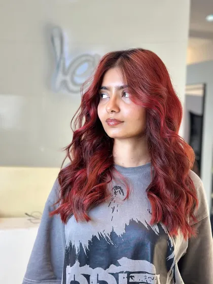 For those feeling a bit more adventurous, a vibrant red can be a stunning choice. I created this deep, fiery red that looks bold and confident, ensuring the color was rich and even from root to tip.