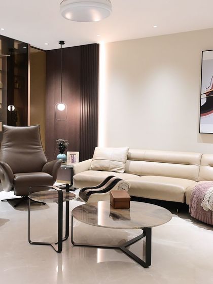 This formal living area in a recently handed-over home shows a clean, modern aesthetic. The lighting and other smart features are designed to be discreet and blend into the background.