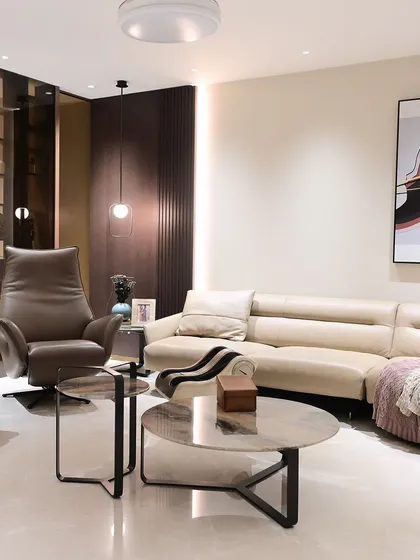 This formal living area in a recently handed-over home shows a clean, modern aesthetic. The lighting and other smart features are designed to be discreet and blend into the background.
