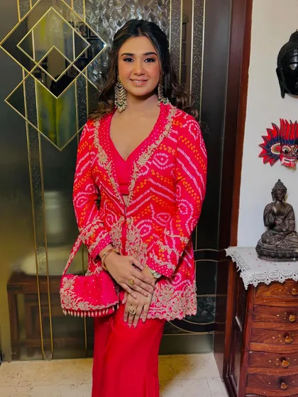 A beautiful smile from a happy client. This look is perfect for any festive wedding occasion, be it mehendi, sangeet, or the main day.