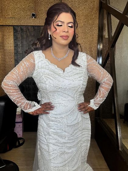 "Don't be afraid to sparkle a little brighter." This bride is glowing with happiness, her makeup enhancing her radiant smile.