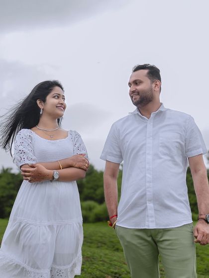 A relaxed portrait with the couple looking at each other. The wind in her hair adds a touch of natural movement to the scene.