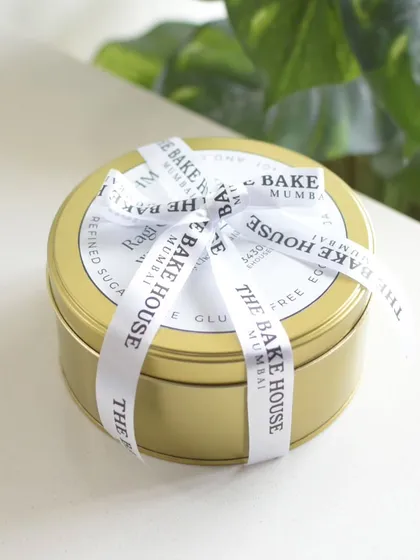 My Ragi Chocolate Walnut Cake tin, wrapped with a custom ribbon from The Bake House.